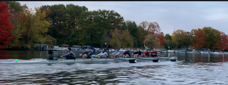 Men's 8 boat rowing on water